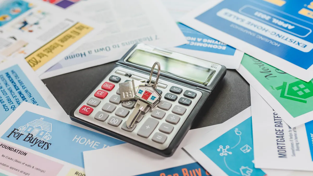Calculator on mortgage brochures and flyers